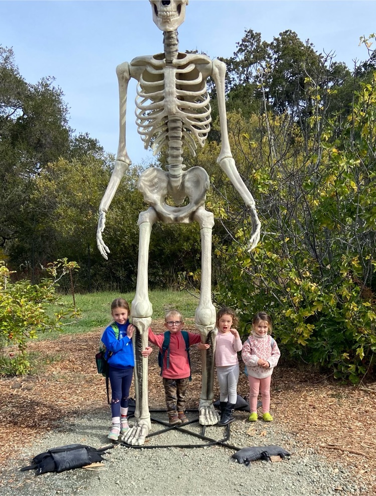 big skeleton and kids